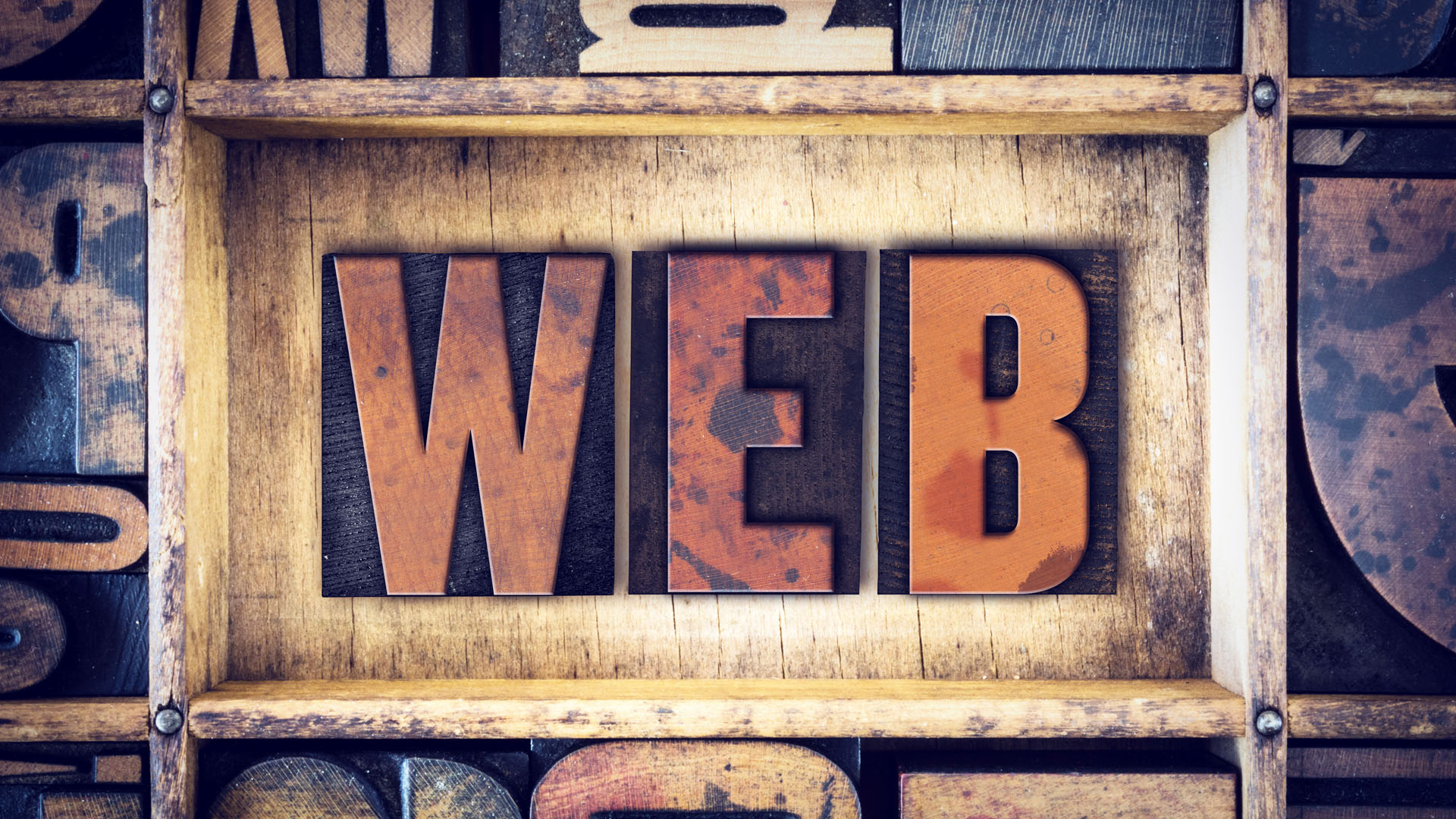 Image of the word WEB in old school print blocks